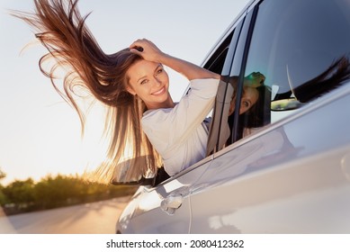 Photo Portrait Smiling Woman Riding In Car Wearing White Casual Shirt With Flying On Wind Hair