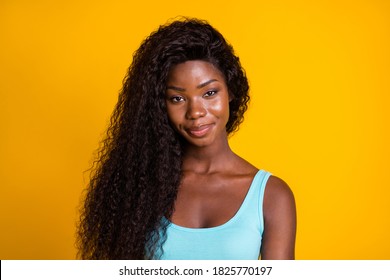 Photo Portrait Of Smug African American Woman Smirking Wearing Blue Tank-top Isolated On Bright Yellow Colored Background