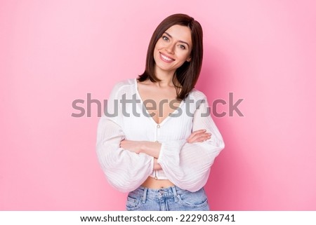 Photo portrait of stunning young lady folded hands toothy beaming smile advert wear trendy white outfit isolated on pink color background