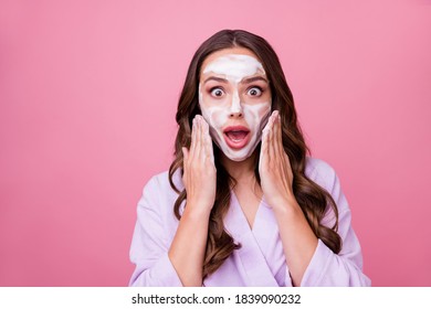 Photo Portrait Of Surprised Amazed Young Woman Applying Cleaner Gel Foam On Skin Wearing Bathrobe Isolated On Pink Color Background