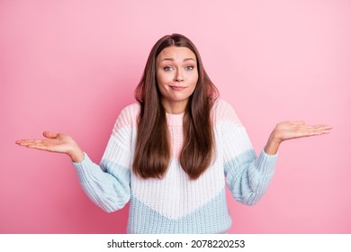 Photo Portrait Of Unsure Clueless Girl Shrugging Shoulders Uncertain Isolated On Pastel Pink Color Background