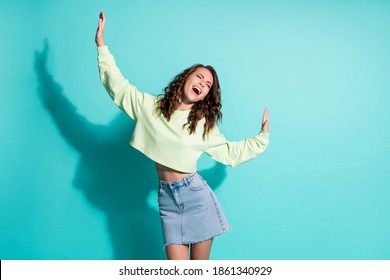 Photo Portrait Of Woman Dancing With Hands Up Isolated On Vivid Cyan Colored Background