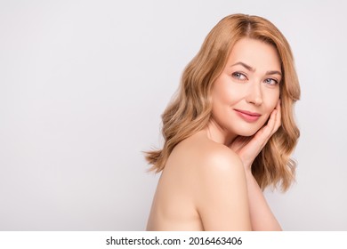 Photo portrait woman naked shoulders touching face in salon isolated white color background copyspace