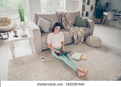 Photo Portrait Of Woman Sitting On Floor Rug With Stretched Legs Laptop On Top Indoors