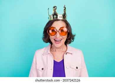 Photo portrait woman wearing golden crown sunglass smiling overjoyed isolated bright turquoise color background - Powered by Shutterstock