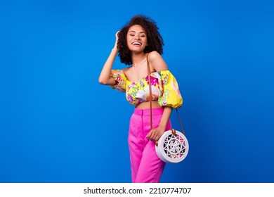 Photo Portrait Of Young Lady Curly Hair Date Compliment Toothy Smile Wear Stylish Colorful Outfit Isolated On Bright Blue Color Background