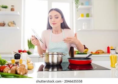 Photo portrait young woman cooking soup smelling scent - Powered by Shutterstock