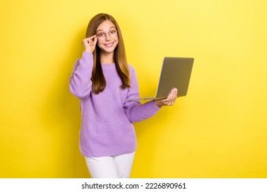 Photo of positiv teenager girl wear cute outfit hold new laptop touch glasses professional juniour programmer developer isolated on yellow color background - Shutterstock ID 2226890961