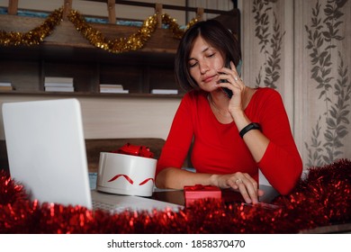 Photo Of Positive Asian Lady Sit In Bedroom And Call By Cellphone With Christmas X-mas Ornament. X-mas, Winter Holidays And People Concept In Covid Time