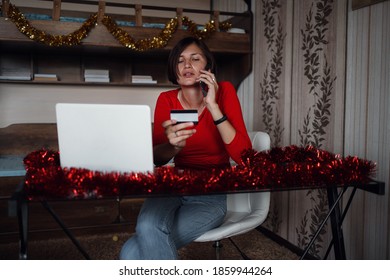 Photo Of Positive Asian Lady Sit In Bedroom And Call By Cellphone With Christmas X-mas Ornament. X-mas, Winter Holidays And People Concept In Covid Time