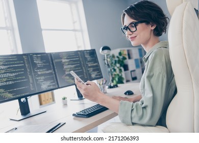 Photo of positive attractive lady sitting chair hold use telephone typing chatting workplace office