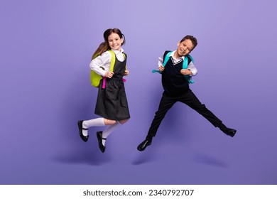 Photo of positive buddies pupils jump wear school bags buying on low price discounts isolated bright color background - Powered by Shutterstock