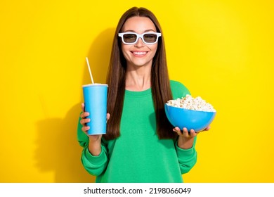 Photo Of Positive Charming Girl Toothy Smile Arms Hold Soda Drink Cup Popcorn Isolated On Yellow Color Background