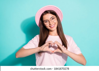 Photo of positive cheerful young lady make fingers heart show endless love symbol isolated on turquoise color background - Powered by Shutterstock