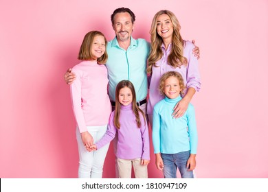 Photo positive dream idyllic harmony family mom dad three kids younger older sister brother enjoy time together hug embrace hold hands wear casual style clothes isolated pink color background - Powered by Shutterstock