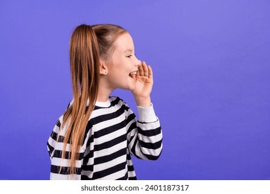 Photo of positive excited little child dressed striped pullover telling announcement empty space isolated purple color background - Powered by Shutterstock