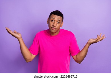 Photo of positive guilty confused uncertain guy with box haircut dressed pink t-shirt shrug shoulders isolated on purple color background - Shutterstock ID 2226498713