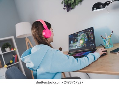 Photo of positive happy cheerful girl little gamer playing online video game weekend indoors house - Powered by Shutterstock