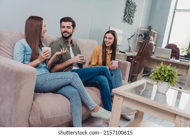 Photo Of Positive Happy Teachers Group Having Coffee Break Talking Sitting Sofa Indoors Workplace Workstation