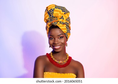 Photo of positive happy young dark skin woman smile face wear turban isolated on abstract light background
