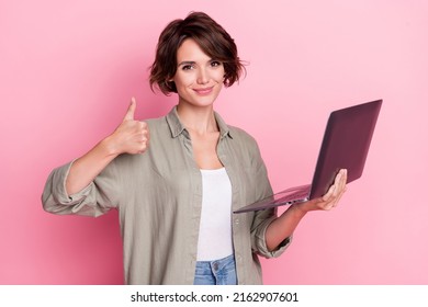 Photo of positive lady marketer use device show thumb up symbol approve wi fi media isolated pastel color background - Shutterstock ID 2162907601