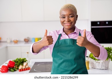 Photo of positive lady two hands fingers demonstrate thumb up feedback rate house indoors - Powered by Shutterstock