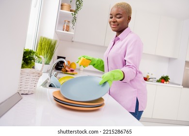 Photo of positive lady wash doing dishes hold sponge have good mood house indoors - Powered by Shutterstock