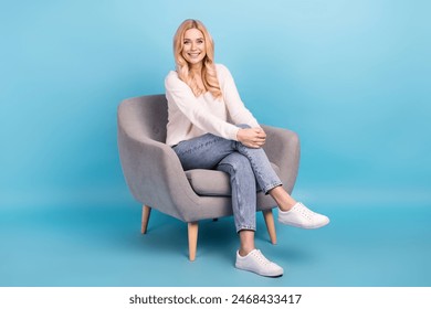 Photo of positive lovely adorable woman wear stylish white clothes sit chair isolated on blue color background - Powered by Shutterstock