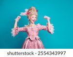 Photo of positive lovely lady wearing queen costume medieval corset gown showing strong arm isolated on blue color background