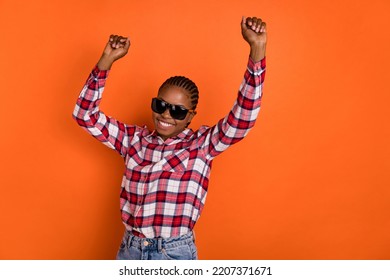 Photo of positive pretty girl enjoy have fun dancing spend pastime isolated on orange color background - Shutterstock ID 2207371671