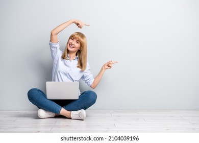 Photo Of Positive Woman Wear Formal Shirt Working Modern Device Empty Space Isolated Concrete Grey Wall Background