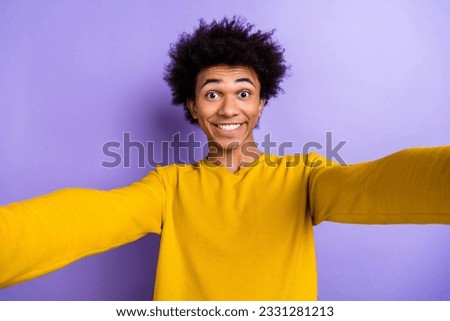 Photo of positive young person beaming smile make selfie recording video isolated on violet color background