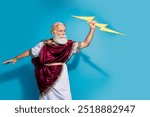 Photo of powerful mature man strike lightning wear ancient roman emperor tunic isolated on blue color background