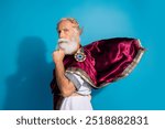 Photo of powerful mature man thinking minded wear ancient roman emperor tunic isolated on blue color background