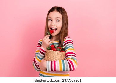 Photo of preschool summertime young kid girl spend her holidays granny village eating sweet strawberries isolated on pink color background - Powered by Shutterstock