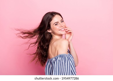 Photo of pretty adorable young lady wear off-shoulders clothes wind blowing smiling arm chin isolated pink color background