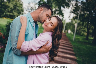 Photo Of Pretty Charming Boyfriend Girlfriend Wear Casual Outfits Walking Stairs Kissing Cheek Enjoying Sunny Weather Outdoors Garden