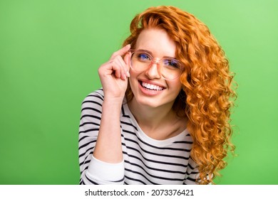 Photo of pretty charming young woman wear striped shirt arm spectacles smiling isolated green color background - Shutterstock ID 2073376421