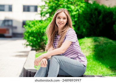 Photo of pretty cheerful lady wear violet t-shirt smiling enjoying walking outdoors urban city park - Powered by Shutterstock