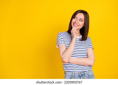 Photo Of Pretty Cunning Girl Wear Striped Outfit Arm Touch Face Interested Look Empty Space Good Idea Isolated On Yellow Color Background