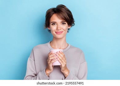 Photo Of Pretty Cute Lovely Positive Lady Dressed Trendy Outfit Sweatshirt Raise Two Arm Hold Glass Water Isolated On Blue Color Background