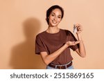 Photo of pretty cute nice charming woman wear brown trendy clothes hold keys buy new house isolated on beige color background