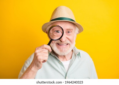 Photo Of Pretty Funky Age Gentleman Wear Green Shirt Spectacles Headwear Loupe Cover Eye Smiling Isolated Yellow Color Background