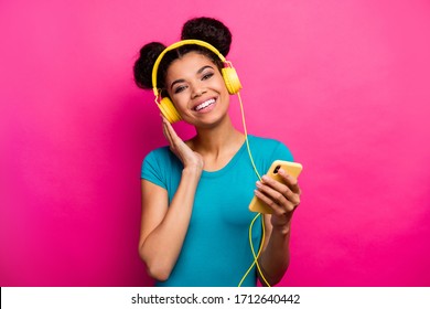 Photo Of Pretty Funny Lady Hold Telephone Hands Listen Fm Music Modern Technology Earphones Good Mood Wear Blue Casual T-shirt Isolated Magenta Color Background