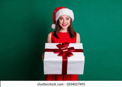 Photo Pretty Girl In Santa Claus Headwear Enjoy X-mas Christmas Spirit Atmosphere Celebration Hold Give Gift Box Her Family Wear Skirt Isolated Green Dark Color Isolated Background