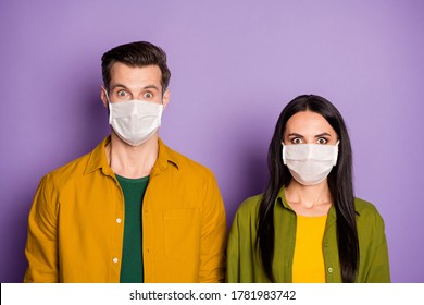 Photo Of Pretty Lady Handsome Guy Watch Tv Newsa Use Respiratory Flu Protective Masks Eyes Full Of Fear Pandemic Crowd People Mass Panic Wear Bright Shirts Isolated Purple Color Background