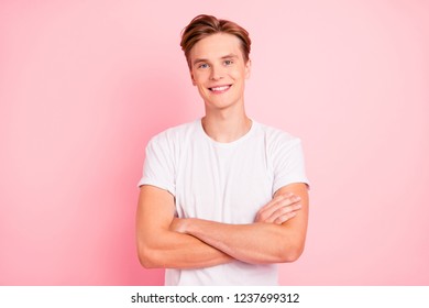 Photo of pretty man stand isolated on bright pink background wall with copy space for text look at camera make beaming toothy smile hold hands over chest