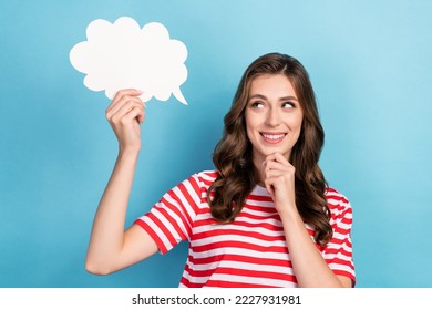 Photo of pretty positive lady interested look empty space hold paper white card dilemma choice choose isolated on blue color background - Powered by Shutterstock