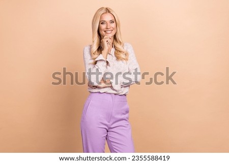 Photo of pretty positive lady secretary hand touch chin dressed stylish clothes isolated on beige color background