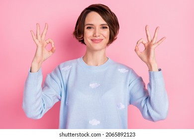 Photo of pretty satisfied person two hands fingers show okey symbol isolated on pink color background